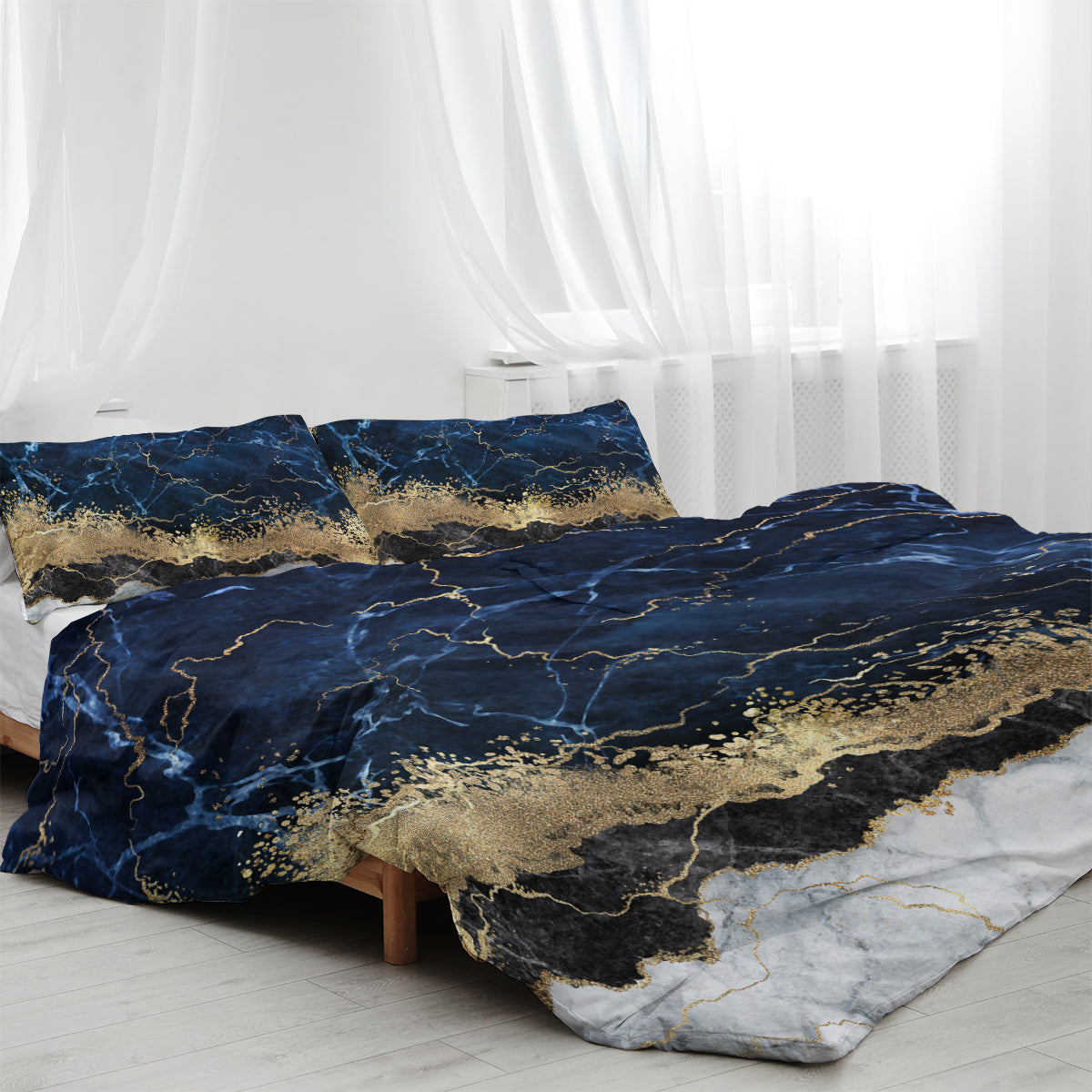 Chic white marble bed linen with gold accents.